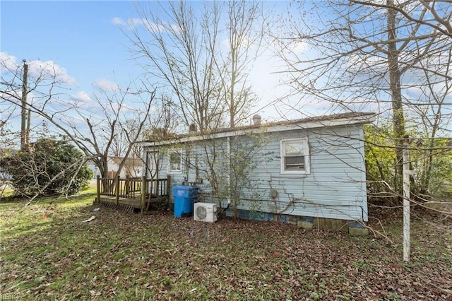 view of home's exterior featuring a wooden deck and ac unit