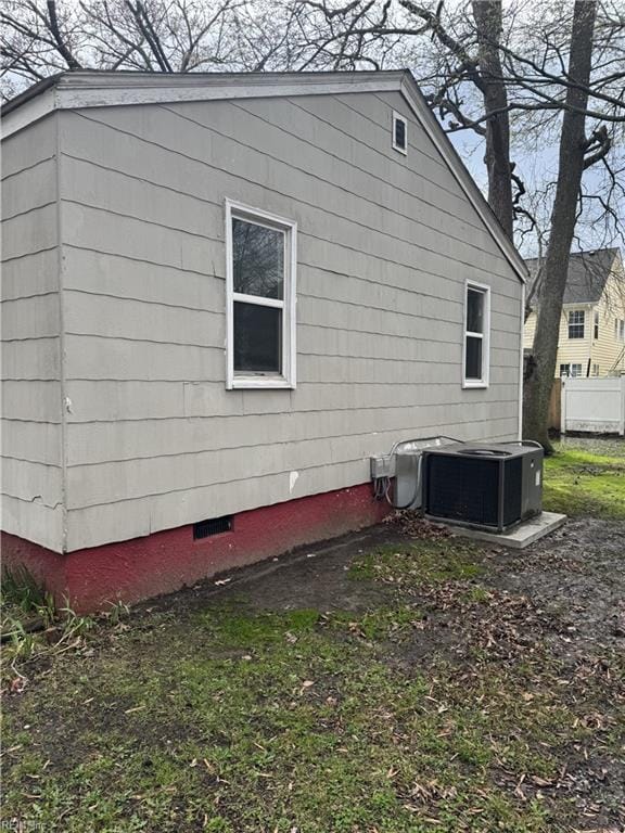 409 Hicks Ave, Norfolk, VA 23502 - view of side of home featuring central air condition unit, fence, and crawl space