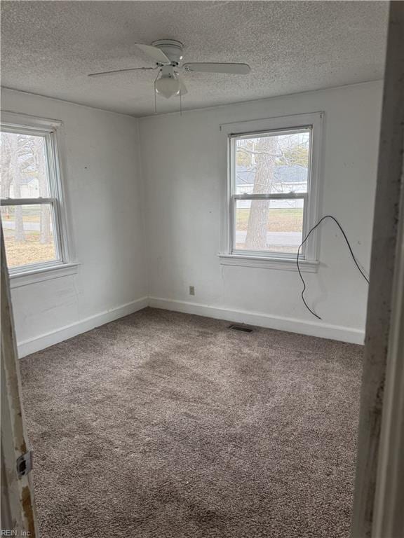 409 Hicks Ave, Norfolk, VA 23502 - spare room featuring visible vents, a textured ceiling, carpet floors, baseboards, and ceiling fan