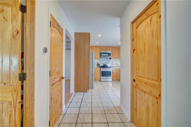 hallway featuring light tile patterned floors