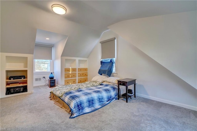 bedroom featuring carpet and lofted ceiling