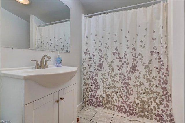 bathroom with tile patterned flooring and vanity