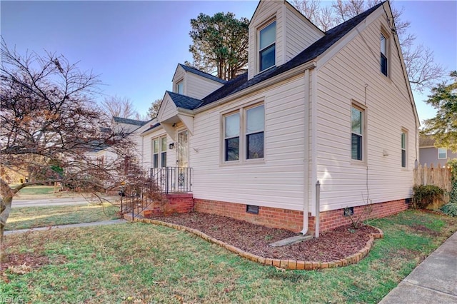 view of home's exterior featuring a lawn