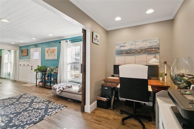 home office with crown molding and hardwood / wood-style floors