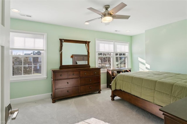 bedroom featuring light carpet and ceiling fan