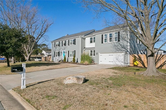 view of front of property with a front yard and a garage