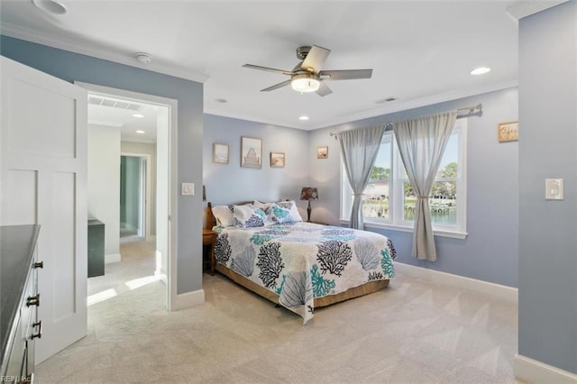 carpeted bedroom featuring ceiling fan and ornamental molding