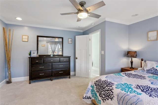 carpeted bedroom featuring ceiling fan, ensuite bathroom, and crown molding