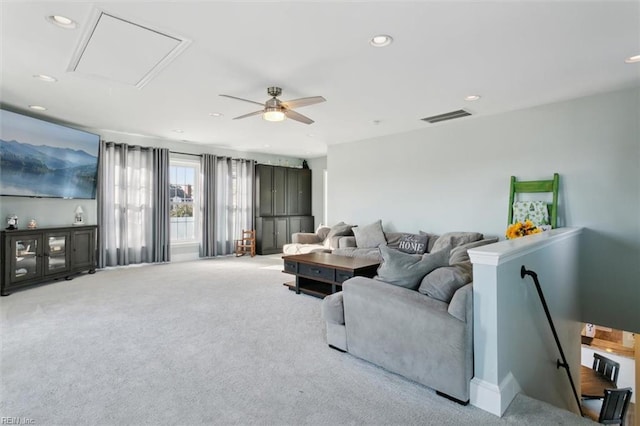 living room with ceiling fan and light carpet