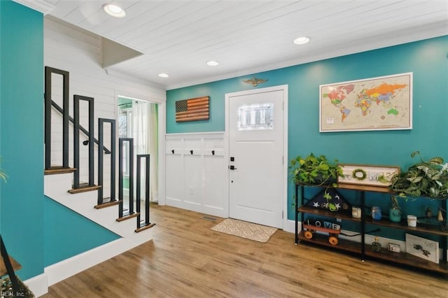 entryway with wood-type flooring and wood ceiling