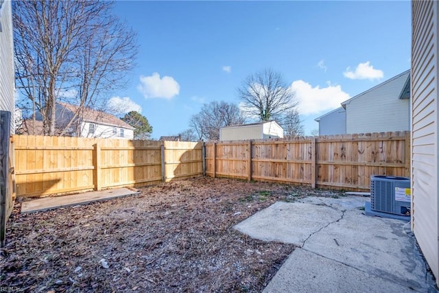 view of yard with a patio and central AC unit