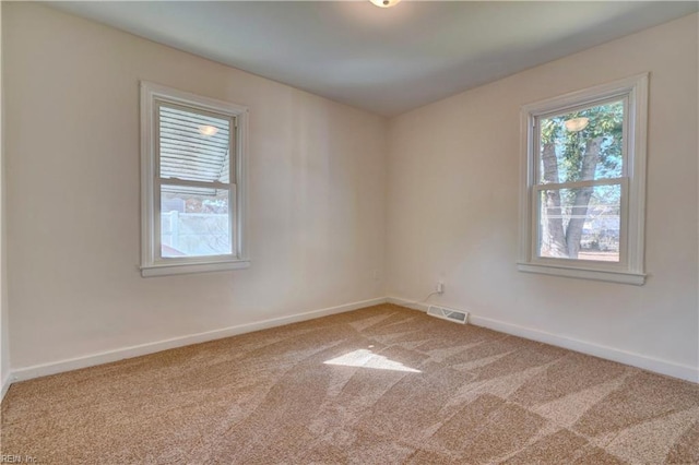 unfurnished room featuring carpet flooring