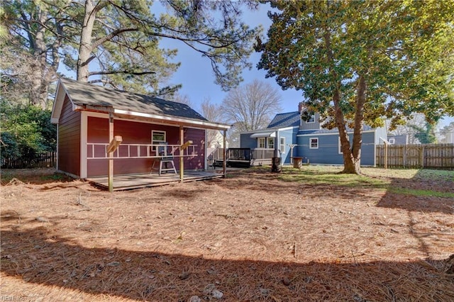 back of property featuring a deck