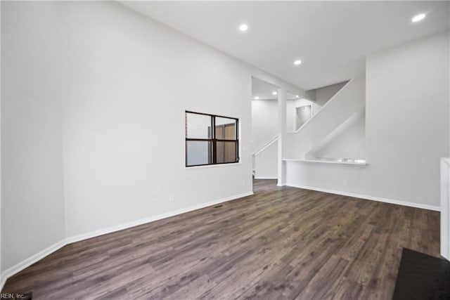 empty room featuring dark wood-type flooring