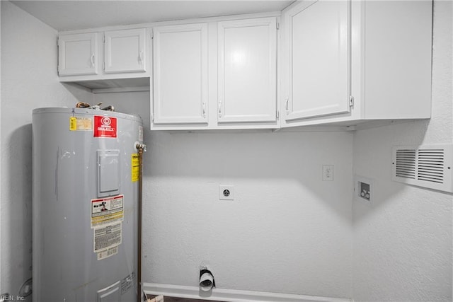 washroom with electric dryer hookup, cabinets, electric water heater, and hookup for a washing machine