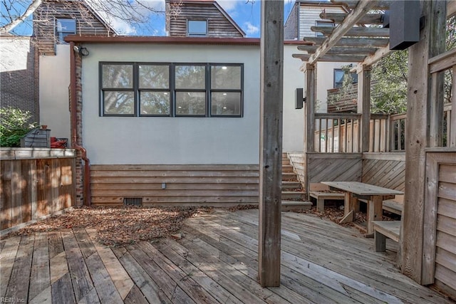 wooden deck featuring a pergola