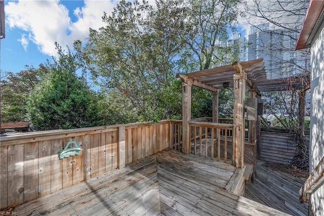 wooden deck featuring a pergola