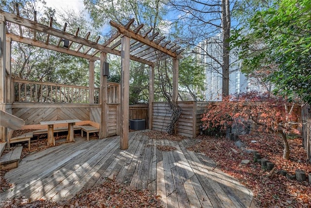 deck featuring a pergola and central AC