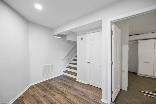 stairs with wood-type flooring