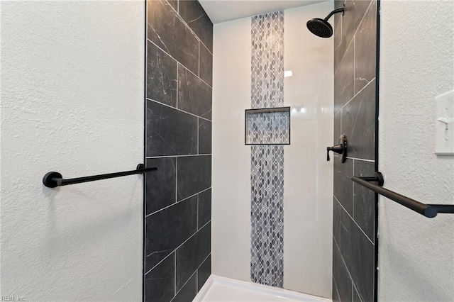 bathroom featuring tiled shower