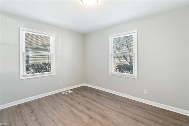 spare room featuring hardwood / wood-style flooring