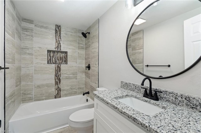 full bathroom with tiled shower / bath combo, toilet, and vanity