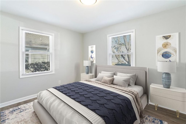 bedroom with dark wood-type flooring