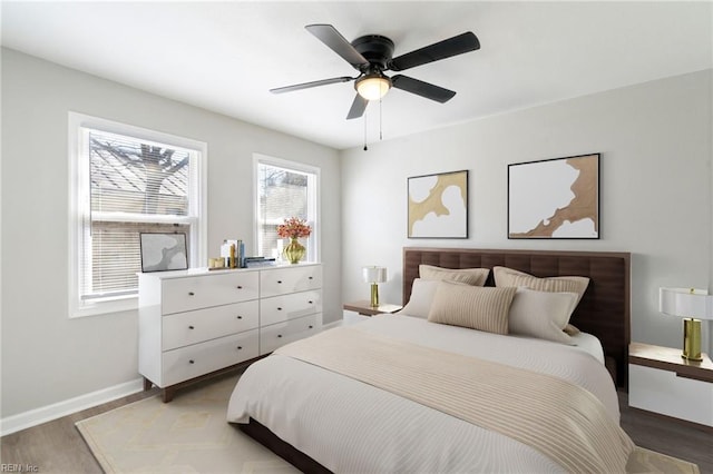 bedroom with hardwood / wood-style flooring and ceiling fan