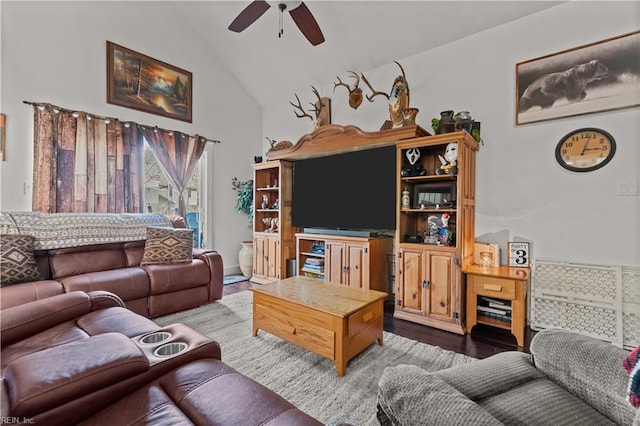 living room featuring ceiling fan, high vaulted ceiling, and dark hardwood / wood-style floors