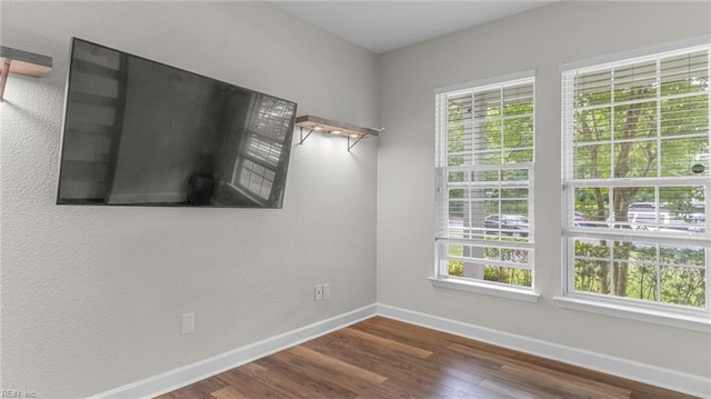 empty room featuring dark hardwood / wood-style floors