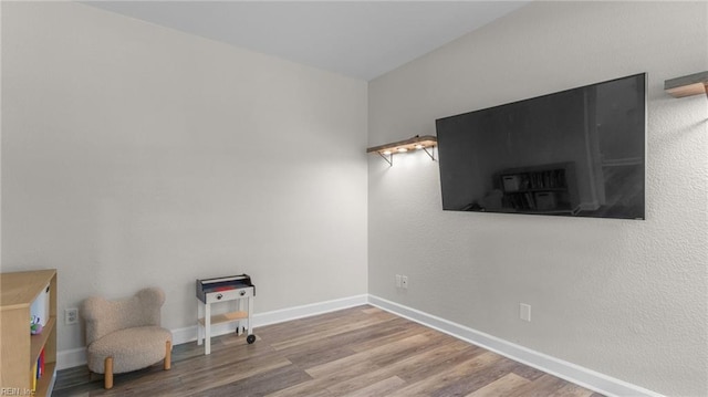 spare room with wood-type flooring