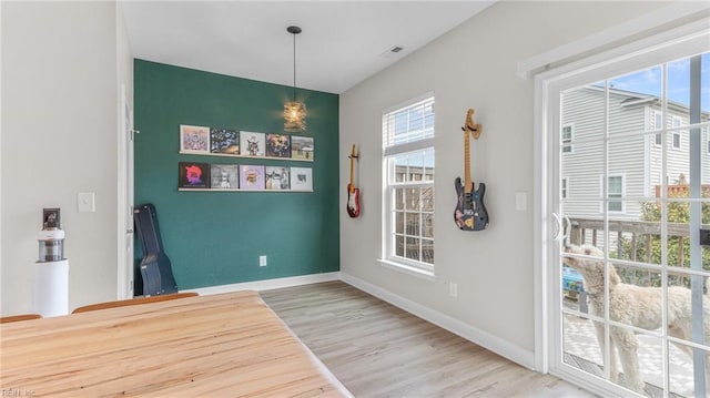 dining space featuring hardwood / wood-style floors