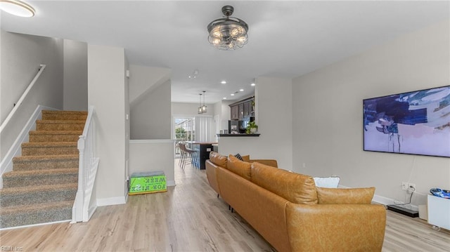 living room with light hardwood / wood-style flooring