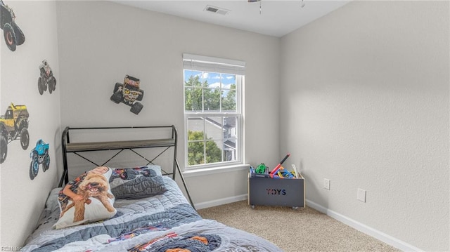 carpeted bedroom with multiple windows