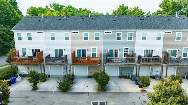 back of property featuring a garage