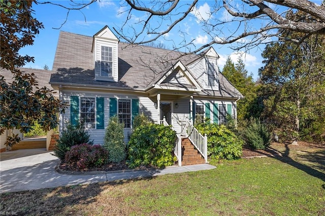 cape cod-style house with a front lawn