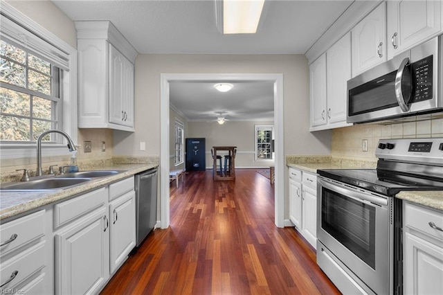 kitchen with white cabinetry, sink, plenty of natural light, and appliances with stainless steel finishes