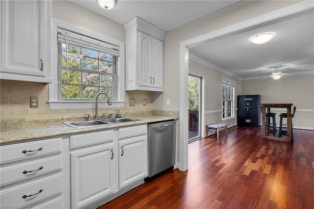 kitchen with stainless steel dishwasher, white cabinetry, sink, and dark wood-type flooring