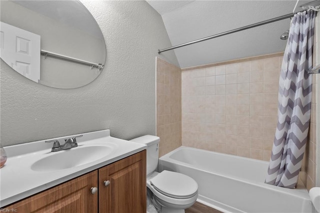 full bathroom featuring vanity, toilet, shower / tub combo, and vaulted ceiling