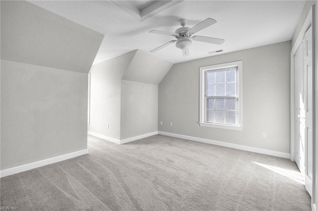 bonus room with light colored carpet, ceiling fan, and lofted ceiling