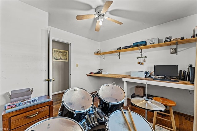 office space featuring ceiling fan and built in desk