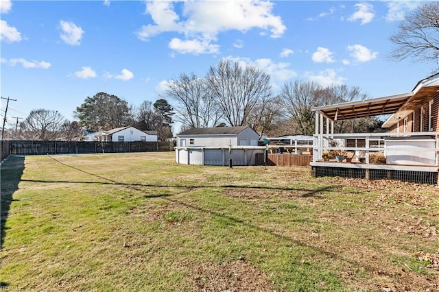 view of yard with a fenced in pool