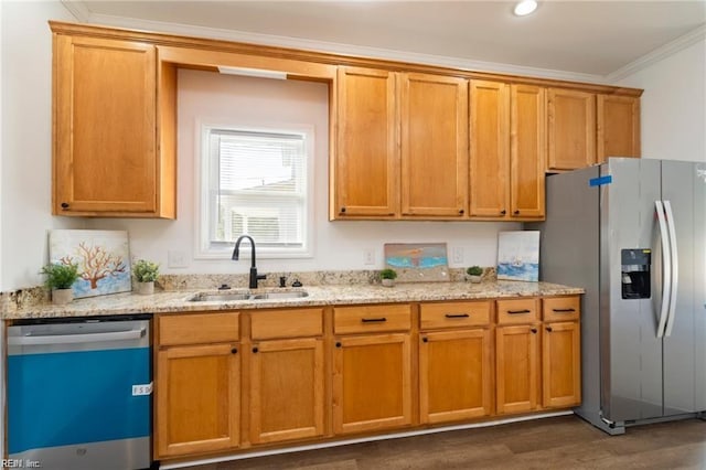 kitchen with crown molding, sink, light stone countertops, appliances with stainless steel finishes, and dark hardwood / wood-style flooring