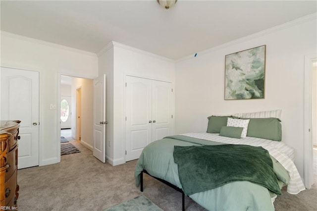 bedroom featuring ornamental molding, light carpet, and a closet