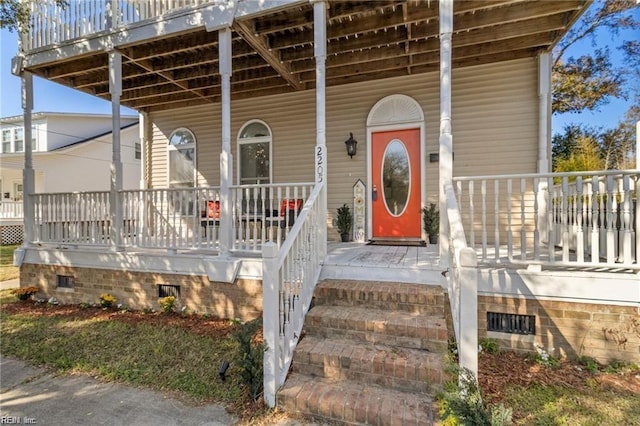 property entrance with covered porch