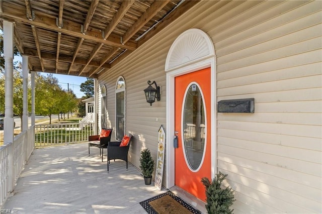 property entrance with covered porch