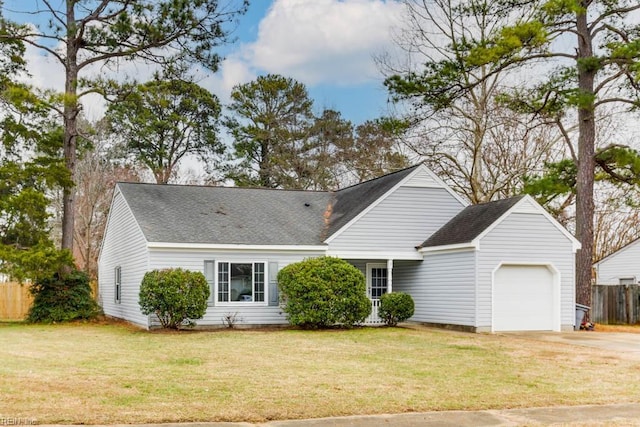 view of front facade with a front yard and a garage