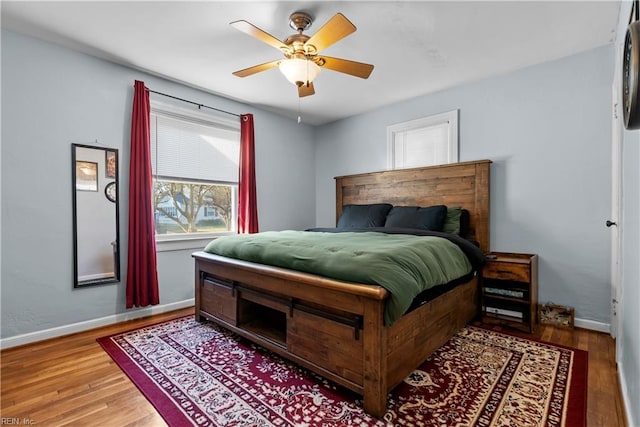 bedroom featuring hardwood / wood-style floors and ceiling fan