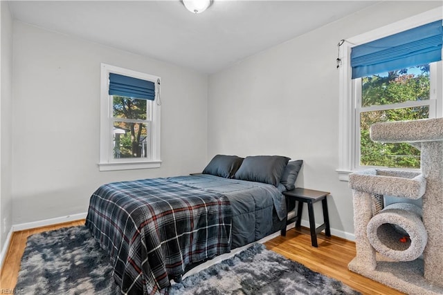 bedroom with wood-type flooring