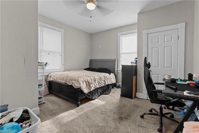 carpeted bedroom with ceiling fan